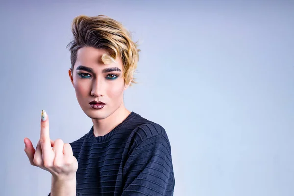 stock image Closeup portrait of a young man with a lipstick over white background.