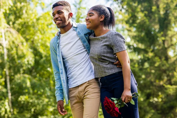 stock image Smiling african couple at romantic picnic in summer park dation at sunny day.