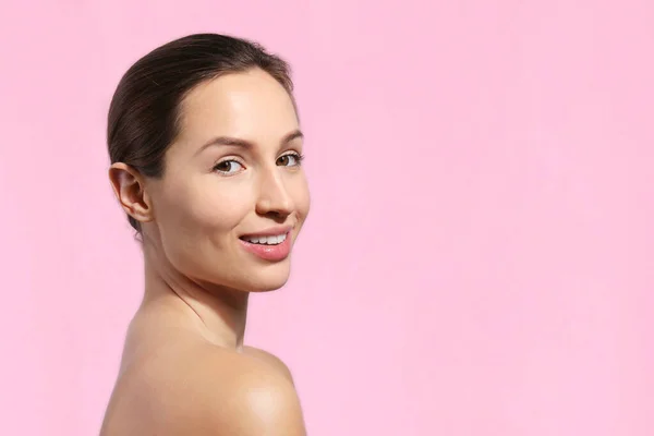 stock image Studio portrait of a young woman with nude makeup on. Female model posing over isolated pink background. Close up, copy space.