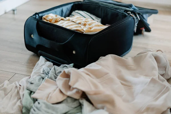 stock image Unpacking suitcase after travel at home. High quality photo