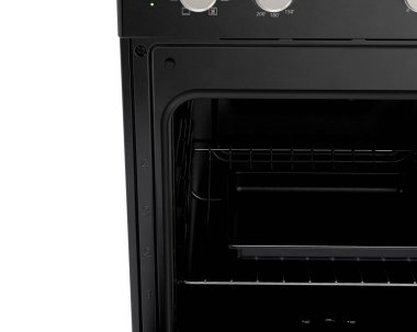 İzole edilmiş arka planda siyah, markasız, serbest çalışan bir ev sobası ve fırın mutfak gereçleri ünitesinin yakın plan bölümü.