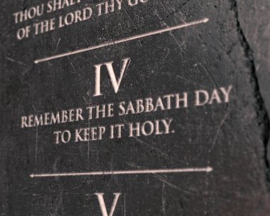 A view of the fourth commandment etched into a cracked stone tablet on an isolated background - 3D render clipart
