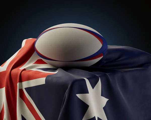 隔離されたスタジオの背景の台座の上に描かれたオーストラリアの旗の上に置かれた通常のラグビーボール 3Dレンダリング — ストック写真