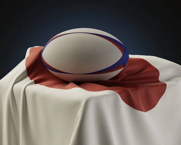 Regelbunden Rugbyboll Vilar Japansk Flagga Draperad Över Sockel Isolerad Studio — Stockfoto
