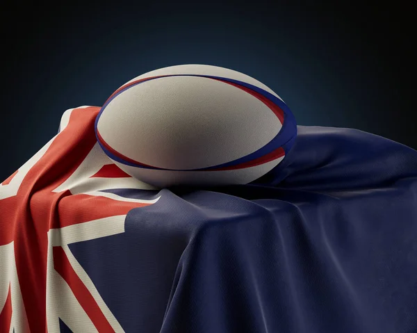 隔絶されたスタジオの背景に描かれたニュージーランドの旗の上に置かれた通常のラグビーボール 3Dレンダリング — ストック写真