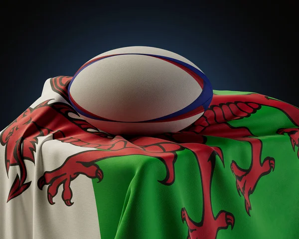 Regular Rugby Ball Resting Wales Flag Draped Plinth Isolated Studio — Stock Photo, Image