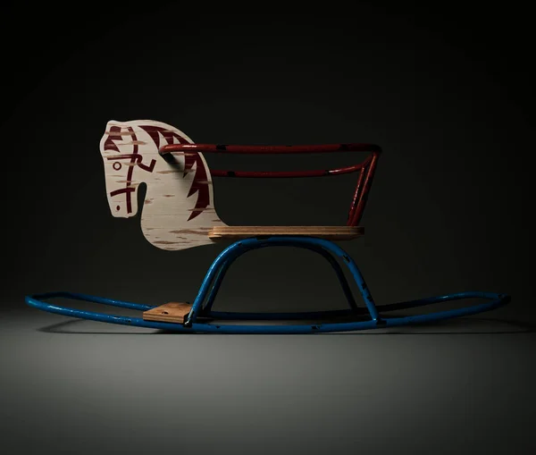 A vintage retro rocking horse seating toy made of iron bars and wood on an isolated dark studio background - 3D render