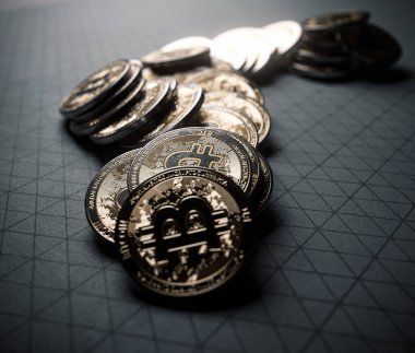 A fallen stack of gold physical bitcoin coins on line paper on a dark background - 3D render