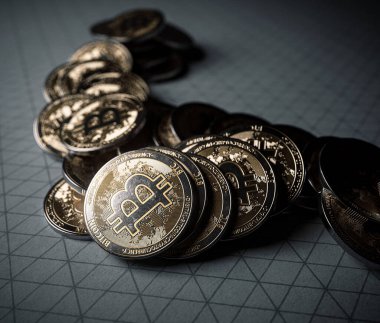 A fallen stack of gold physical bitcoin coins on line paper on a dark background - 3D render