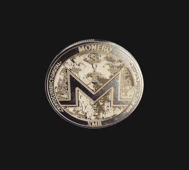A dimly lit physical monero cryptocurrency in bronze and silver coin form on a dark studio background- 3D render