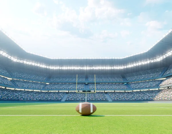 An American football on the centre line in a stadium with posts on a marked green grass pitch in the daytime - 3D render