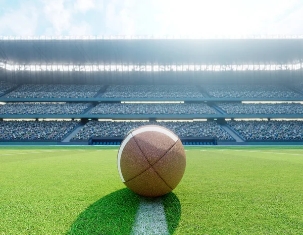 An American football on the centre line in a stadium with posts on a marked green grass pitch in the daytime - 3D render