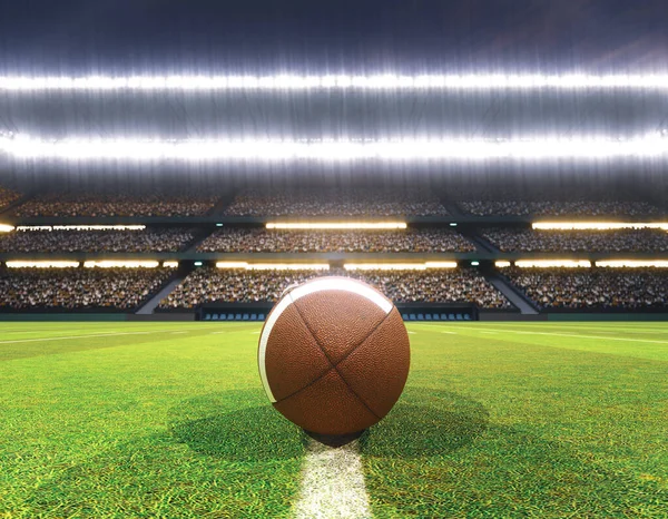 An American football on the centre line in a stadium with posts on a marked green grass pitch at night under illuminated floodlights - 3D render