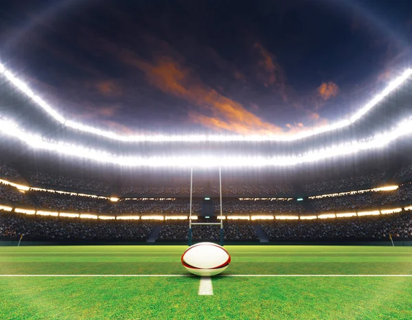 ラグビースタジアムの中央線にあるラグビーボールで ライトアップされた照明の下で夜に緑色の芝生のピッチに投稿されます 3Dレンダリング — ストック写真
