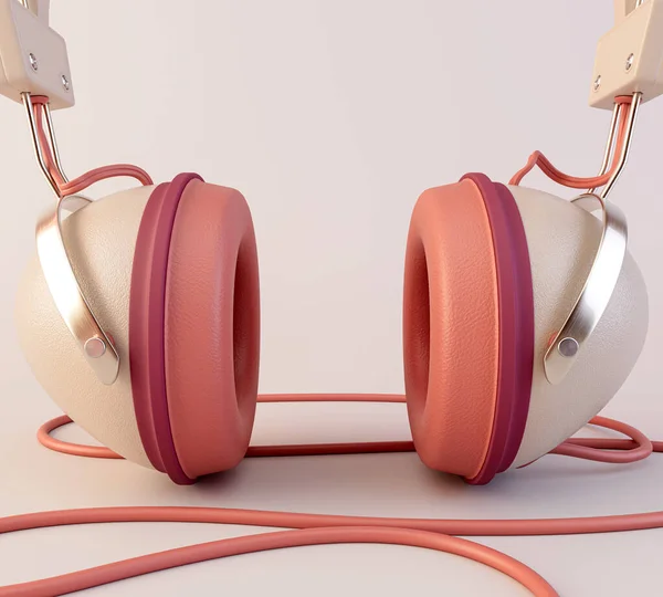 stock image A vintage set of classic headphones  with a cable and jack plug in a modern pink color combination on an isolated background - 3D render