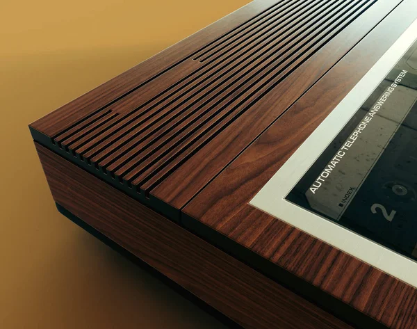 A vintage analogue answering machine from the 80's made of wood and chrome on an isolated mustard yellow background - 3D render