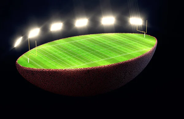 Американский Футбольный Мяч Разделенный Пополам Показывает Заметное Зеленое Футбольное Поле — стоковое фото