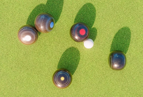 A set of old wooden lawn bowls next to a jack on a perfect flat green grass lawn outdoors - 3D render