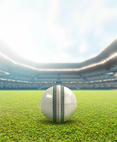 stock image A generic seated cricket stadium showing a white cricket ball on a green grass surface in the day time under a blue cloudy sky - 3D render