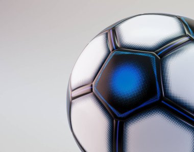 İzole edilmiş bir stüdyo arka planında, renk desenli ve gamzeli modern bir futbol topunun yakın çekim bölümü.