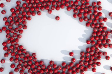 Rastgele aralıklı kırmızı, genel kriket toplarından oluşan geniş bir dizi merkezde net bir dairesel alan oluşturur.