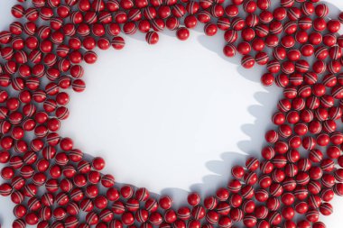 Rastgele aralıklı kırmızı, genel kriket toplarından oluşan geniş bir dizi merkezde net bir dairesel alan oluşturur.