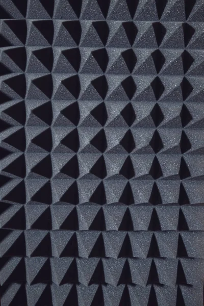 Soundproof wall in sound studio, background of sound absorbing sponge. Close up of sound proof coverage in music studio