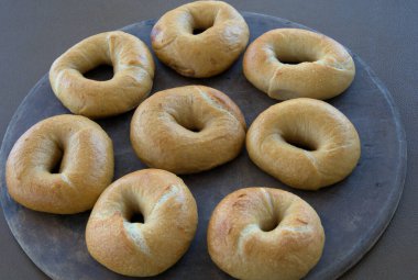 Sour Dough Bagels fresh out of the oven on a pizza stone