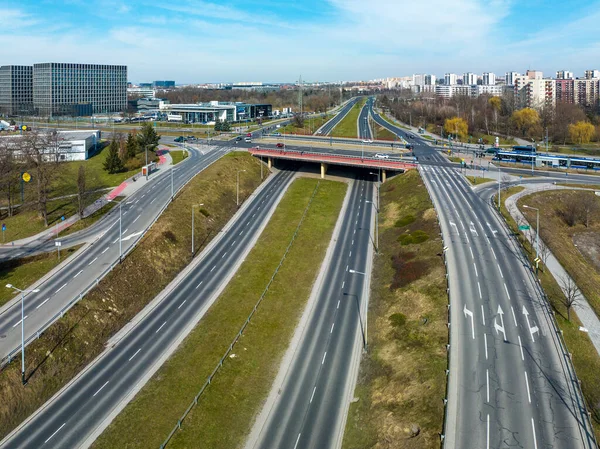City highway multilevel junction in Krakow, Poland. Tramway and tram, bus, cars, cycle tracks and public parks. Aerial view