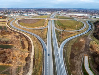 Modlnica interchange on S52, part of highway ring road around Krakow opened on December 23, 2024. Multilevel junction with viaducts, enter and exit ramps and traffic clipart