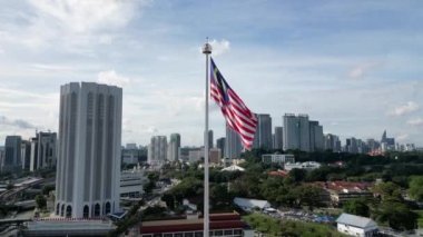 Bukit Bintang, Kuala Lumpur, Malaysia - Dec 05 2022: Aerial view big Malaysia flag waving at Dataran Merdeka