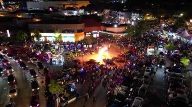 Juru, Penang, Malaysia - Oct 08 2022: Aerial view spit fire performance during car show outdoor in night