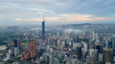 Bukit Bintang, Kuala Lumpur, Malaysia - Dec 01 2022: Aerial revealing KL City town in misty morning