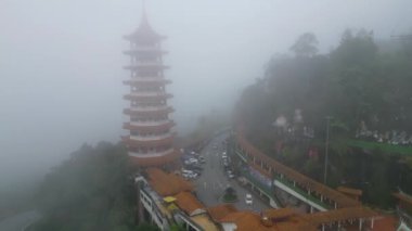 Genting, Pahang, Malaysia - Dec 04 2022: Aerial view misty over Chin Swee Caves Temple