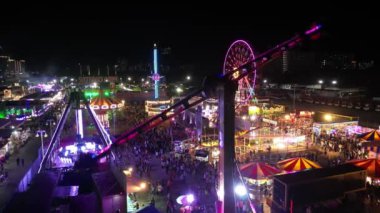Sungai Nibong, Penang, Malaysia - Dec 16 2022: Aerial view hammer ride at Pesta fun fair Pulau Pinang in night