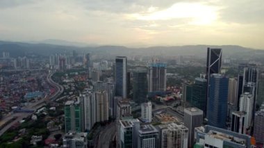 Bukit Bintang, Kuala Lumpur, Malaysia - Dec 25 2022: Aerial view move over skyscraper KL in sunrise