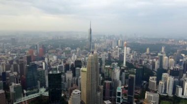 Bukit Bintang, Kuala Lumpur, Malaysia - Dec 25 2022: Aerial fly toward skyline KLCC in morning