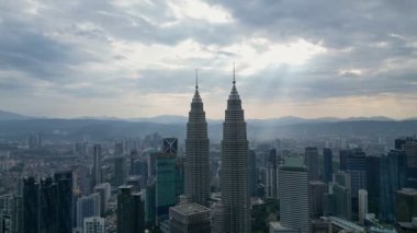 Bukit Bintang, Kuala Lumpur, Malaysia - Dec 25 2022: Aerial surround KLCC during sun ray morning