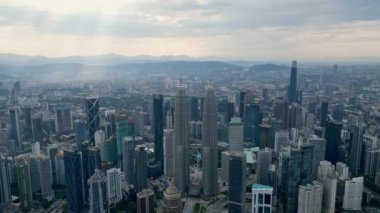Bukit Bintang, Kuala Lumpur, Malaysia - Dec 25 2022: Aerial surround KLCC and Bukit Bintang in sun ray morning