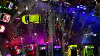 Juru, Penang, Malaysia - Oct 08 2022: Aerial ascending look down colorful car show in night