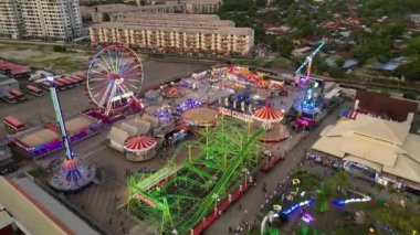 Sungai Nibong, Penang, Malaysia - Dec 16 2022: Drone shot toward fun fair in evening hour