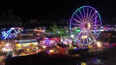 Sungai Nibong, Penang, Malaysia - Dec 16 2022: Aerial fly toward Penang Pesta fun fair in night