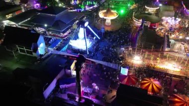 Sungai Nibong, Penang, Malaysia - Dec 31 2022: Bird eye view light trail of fun fair amusement park at Pesta Pulau Pinang