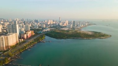 Drone hyperlapse Jelutong Drive toward Georgetown, Penang in morning bright sun