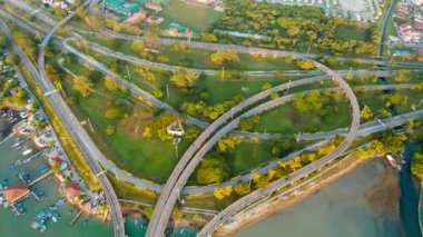 Aerial tracking the Penang Bridge Highway Interchange traffic in sunshine morning