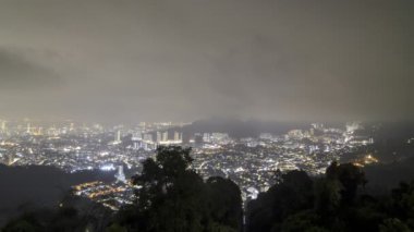 Zoom in low raining cloud move over Farlim town, Penang. Timelapse cloud moving