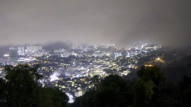 Top view firework at Ayer Itam, Farlim town during foggy night. Timelapse low cloud