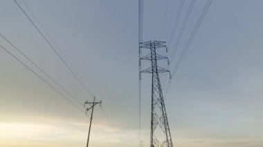Timelapse electric tower in cloudy day morning
