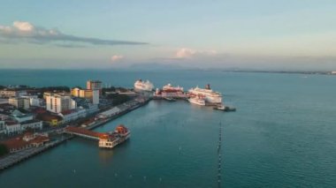 Sungai Nibong, Penang, Malaysia - Jan 06 2022: Aerial hyperlapse view Penang Port Swettenham of busy ship traffic in evening