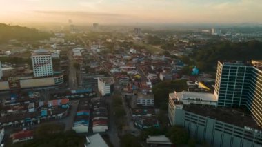 Georgetown, Penang, Malaysia - Jan 09 2022: Aerial morning car traffic at old Bukit Mertajam town in sunshine morning. Hyperlapse view car traffic